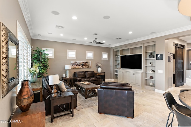 living room featuring built in shelves, ceiling fan, and ornamental molding