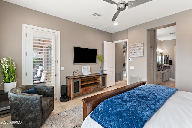 bedroom featuring ceiling fan and ensuite bath