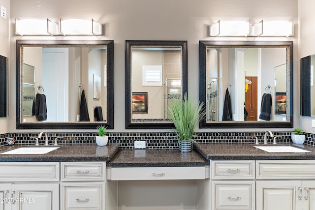 bathroom with vanity and decorative backsplash