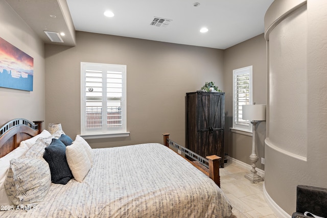 bedroom featuring multiple windows