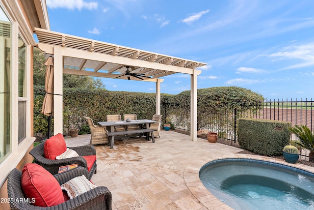 view of patio featuring a hot tub, ceiling fan, and a pergola