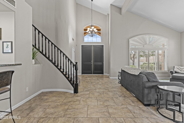 1244 W Straford Ave, Gilbert, AZ 85233 - entryway with a chandelier, baseboards, stairway, high vaulted ceiling, and stone finish flooring