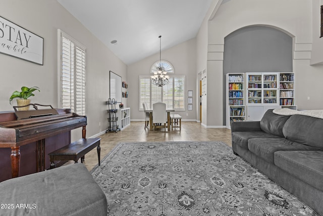 1244 W Straford Ave, Gilbert, AZ 85233 - living room with a chandelier, lofted ceiling, and baseboards