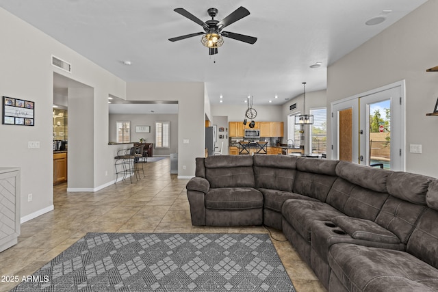 1244 W Straford Ave, Gilbert, AZ 85233 - living room with ceiling fan, light tile patterned flooring, baseboards, a chandelier, and recessed lighting