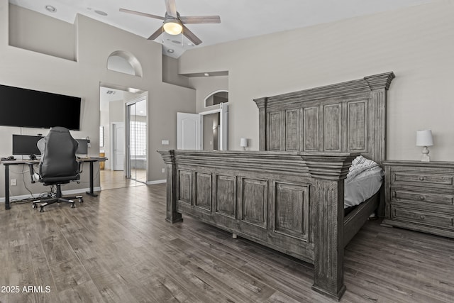 1244 W Straford Ave, Gilbert, AZ 85233 - bedroom featuring an office area, dark wood-style flooring, baseboards, and high vaulted ceiling