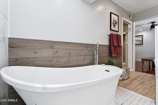 7835 E Cannon Dr, Scottsdale, AZ 85258 - full bath with a soaking tub and a ceiling fan