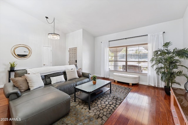 7835 E Cannon Dr, Scottsdale, AZ 85258 - living room with wood finished floors, a chandelier, and high vaulted ceiling