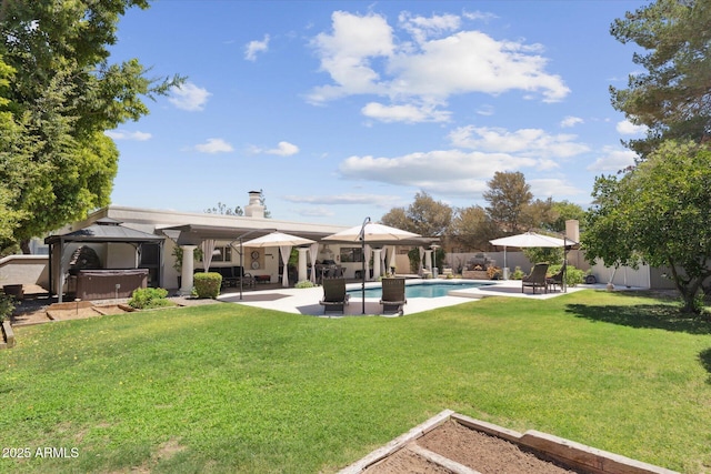 7835 E Cannon Dr, Scottsdale, AZ 85258 - view of green lawn with a gazebo, a hot tub, and a patio area