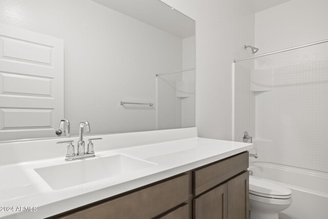 full bathroom featuring shower / tub combination, vanity, and toilet