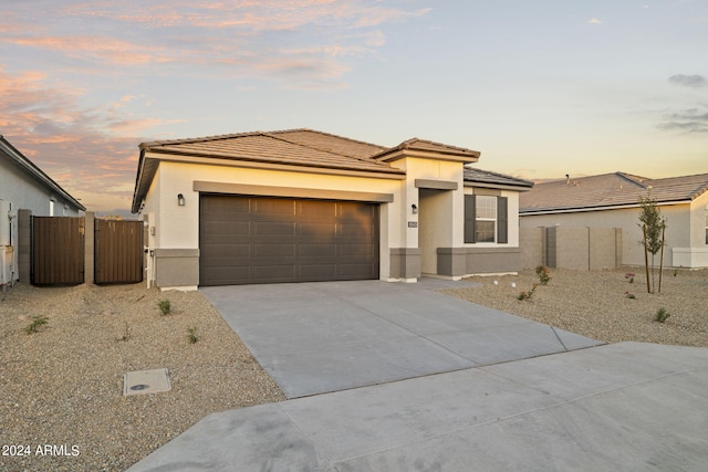 prairie-style home featuring a garage