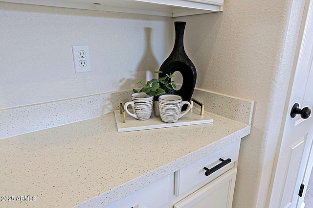 interior details featuring white cabinets