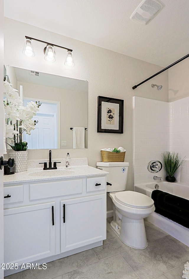 full bathroom with vanity, bathtub / shower combination, and toilet