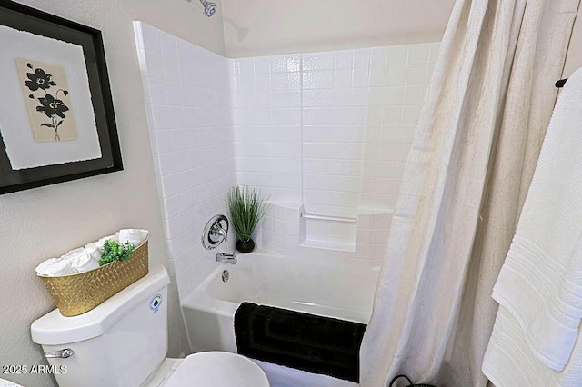 bathroom with shower / bath combination with curtain and toilet