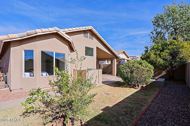 view of property exterior featuring a patio