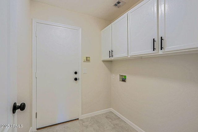 laundry area featuring cabinets and washer hookup