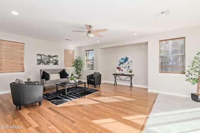 living area featuring recessed lighting, baseboards, ceiling fan, and wood finished floors