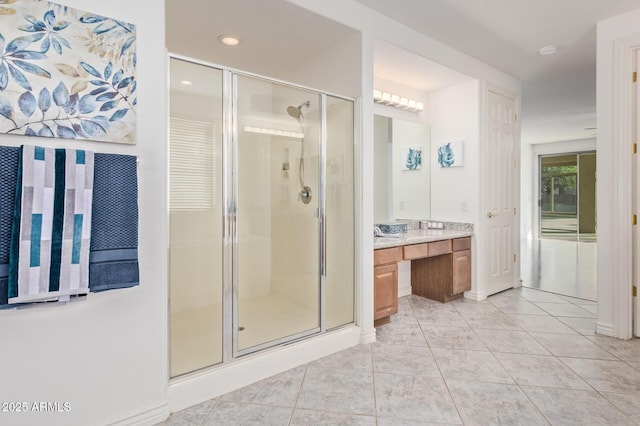 full bathroom featuring vanity, tile patterned floors, a shower stall, and recessed lighting