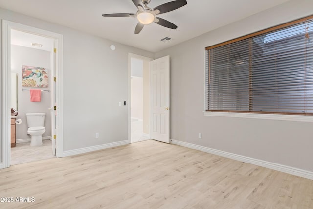 unfurnished bedroom featuring visible vents, light wood finished floors, and baseboards