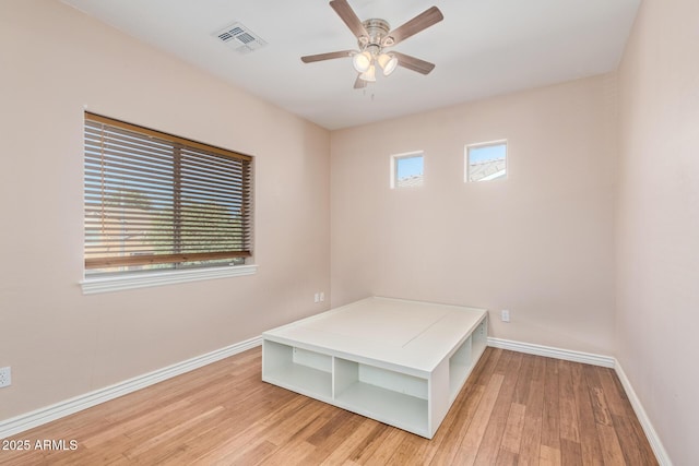 unfurnished bedroom with baseboards, visible vents, and light wood-type flooring