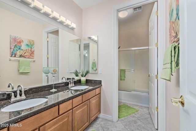 full bath featuring visible vents, a sink, tile patterned flooring, and double vanity