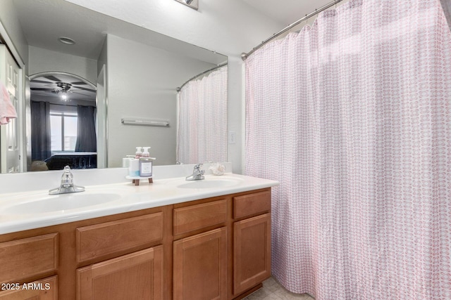 45 S 238th Dr, Buckeye, AZ 85396 - bathroom featuring double vanity, ensuite bath, ceiling fan, and a sink