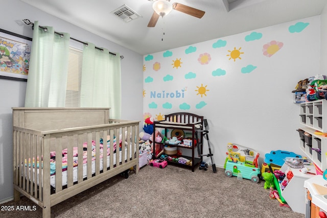45 S 238th Dr, Buckeye, AZ 85396 - carpeted bedroom featuring a nursery area, visible vents, and a ceiling fan