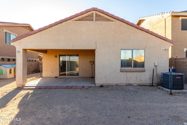 45 S 238th Dr, Buckeye, AZ 85396 - back of house featuring stucco siding, a patio, fence, and central air condition unit