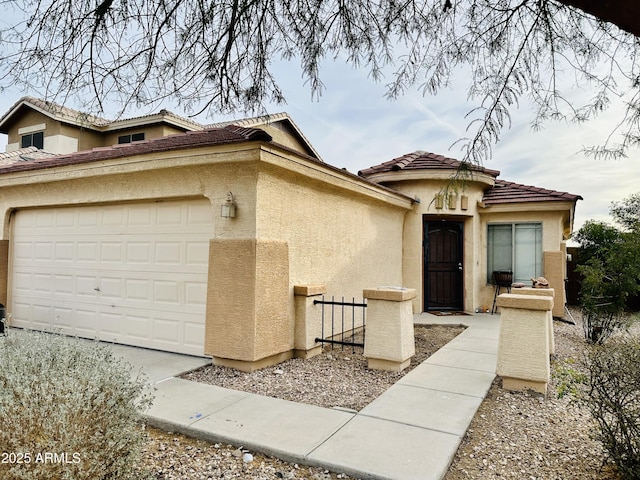 45 S 238th Dr, Buckeye, AZ 85396 - view of front facade with a garage, a tiled roof, and stucco siding