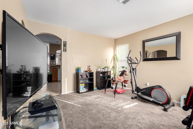 45 S 238th Dr, Buckeye, AZ 85396 - workout area with arched walkways, light carpet, and baseboards