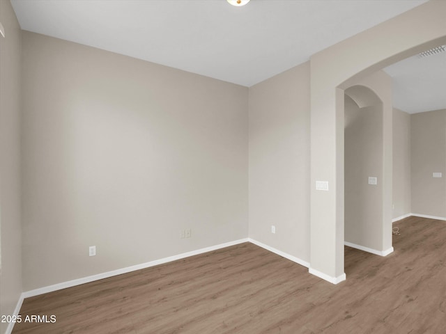 spare room featuring hardwood / wood-style flooring