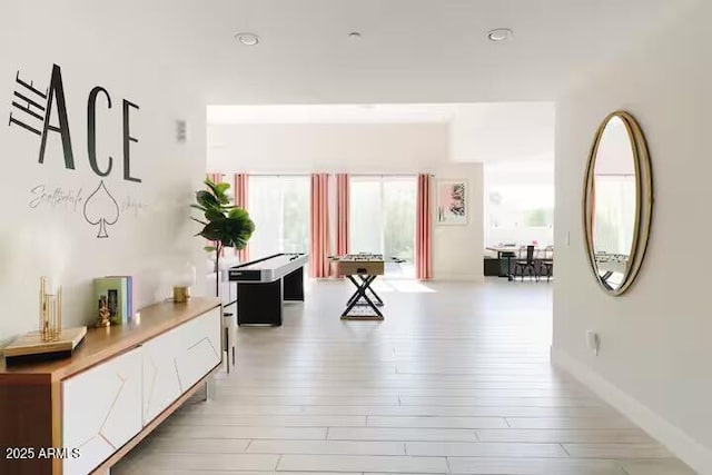 hallway featuring light hardwood / wood-style flooring