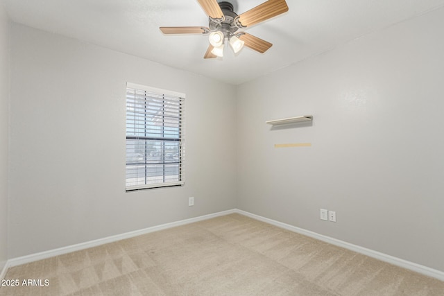 1240 E Indigo St, Mesa, AZ 85203 - unfurnished room with baseboards, ceiling fan, and light colored carpet