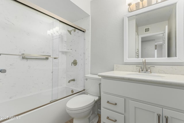 1240 E Indigo St, Mesa, AZ 85203 - bathroom with toilet, visible vents, shower / bath combination with glass door, and vanity