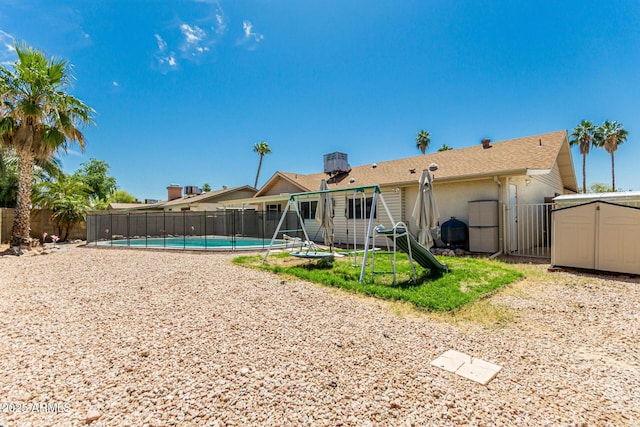 1240 E Indigo St, Mesa, AZ 85203 - rear view of house with a fenced backyard, a fenced in pool, and stucco siding