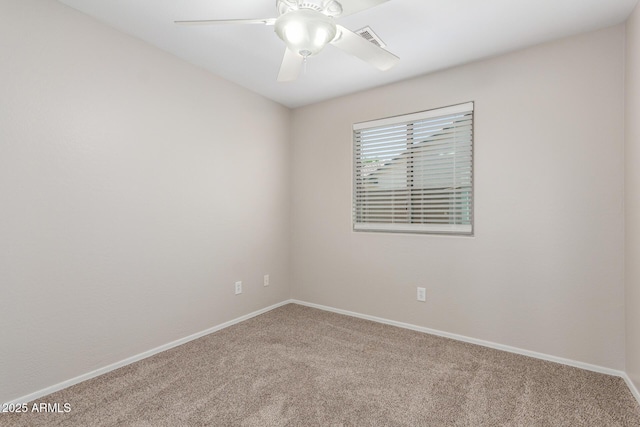 unfurnished room featuring visible vents, a ceiling fan, baseboards, and carpet