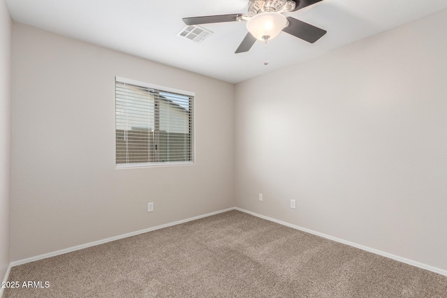 unfurnished room featuring baseboards, visible vents, carpet flooring, and ceiling fan