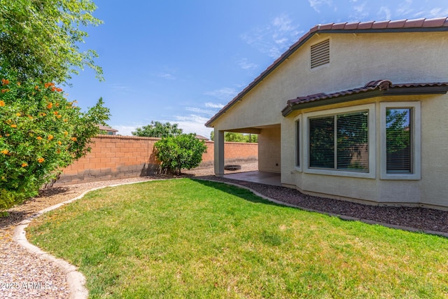 view of yard with a patio area and fence