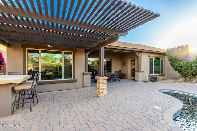 view of patio / terrace with outdoor dry bar and outdoor dining area