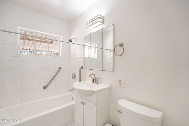 full bathroom with washtub / shower combination, toilet, and vanity