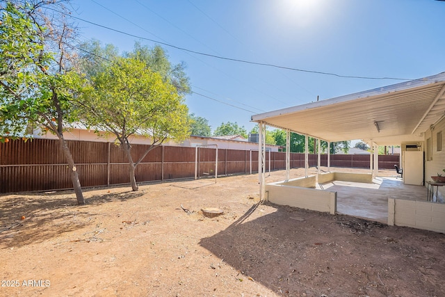 view of yard featuring a patio area and a fenced backyard