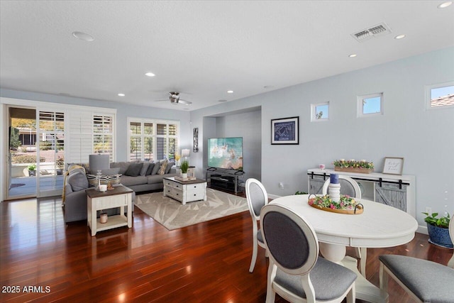 dining area with ceiling fan and hardwood / wood-style floors