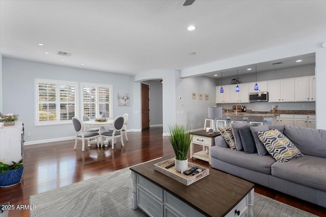 living room featuring dark hardwood / wood-style floors