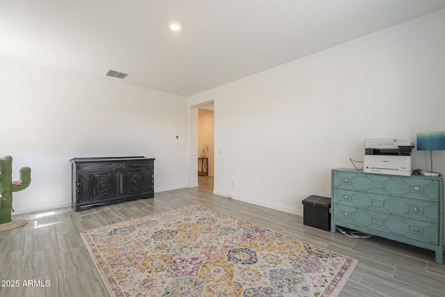 bedroom with wood tiled floor, visible vents, and baseboards