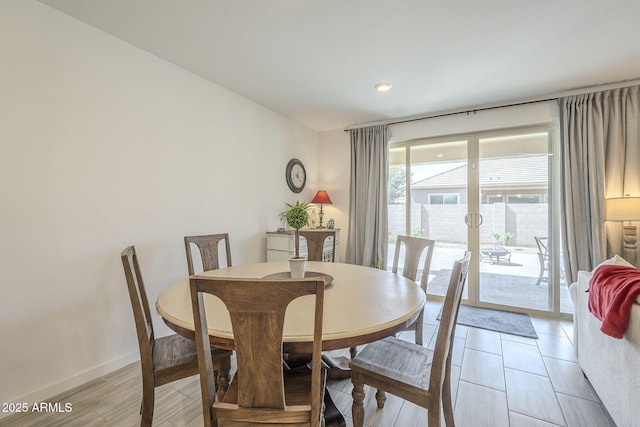 dining space featuring baseboards