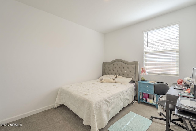 bedroom featuring carpet flooring and baseboards