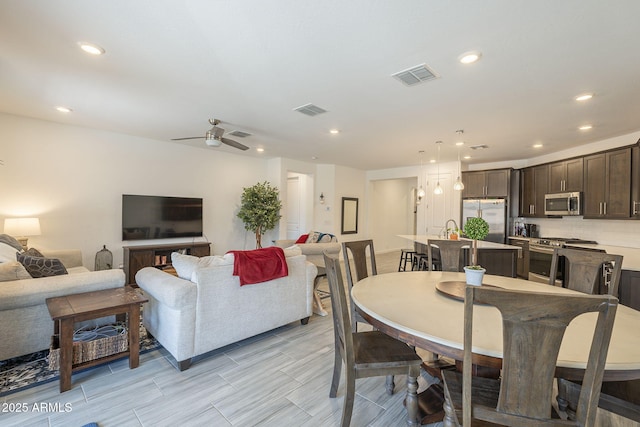 dining space featuring ceiling fan, visible vents, and recessed lighting