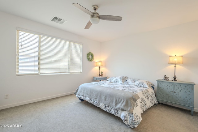 carpeted bedroom featuring visible vents, ceiling fan, and baseboards