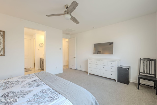 bedroom with light carpet, ceiling fan, baseboards, and ensuite bathroom