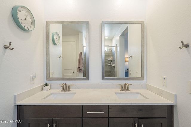 bathroom with a sink and double vanity