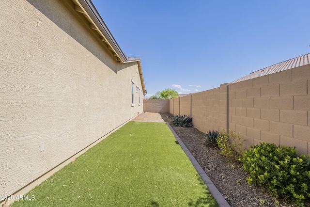 view of yard with a fenced backyard